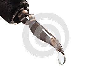 Water drop dripping from the tip pen