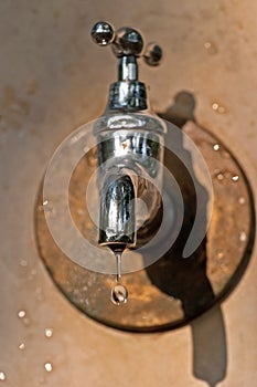 Water drop falling after closing the tap