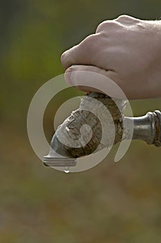 Water drop falling after closing the tap