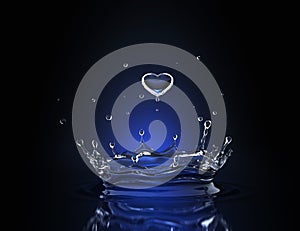 Water drop in form of heart in blue spot light