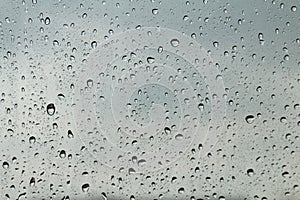 Water drop fresh condensation on window glass texture, rainy season wet background cooling feels and cold, raindrops texture wet t