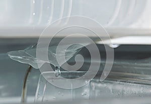 Water drop from ice in refrigerator while defrost and cleaning