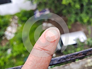 Water drop of rain on finger tip