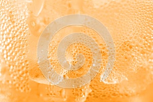 Water drop soda ice baking background fresh cool ice orange texture, selective focus