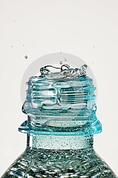 Water drop splash in bottle