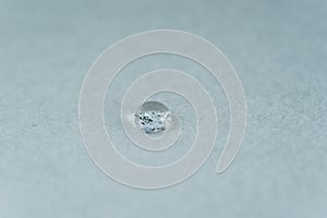 water drop on top of white fabric sheet