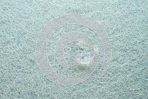 water drop on top of white fabric sheet