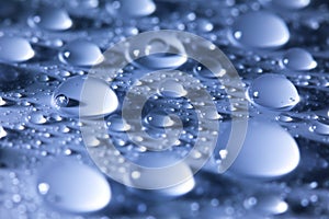 Water droplets blue abstract background -- super macro