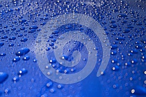 Water Droplets on Blue Car Hood