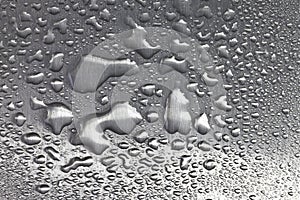 Water droplets on brushed metal surface