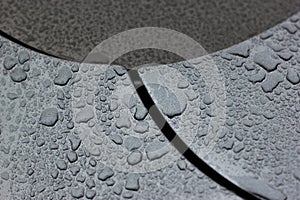 Water droplets on car black surface