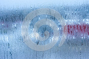 Water droplets condensation background of dew on glass, humidity and foggy blank background. Condensation on the glass of metal-