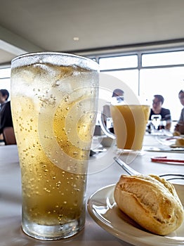 Water droplets condensation outside a soft drink glass on a table