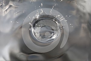 Water droplets falling on the water surface