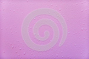 Water droplets on pink background. For as a background drop on the product