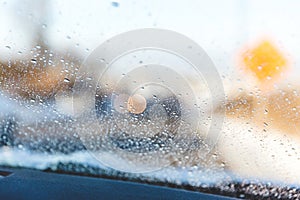 Water Droplets of Rain or Melted Snow on a Windshield