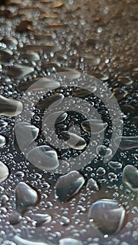 Water droplets on a silver metallic surface background