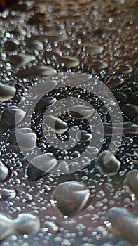 Water droplets on a silver metallic surface background