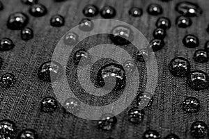 Water droplets on the surface of the water-repellent fabric. Waterproof material.
