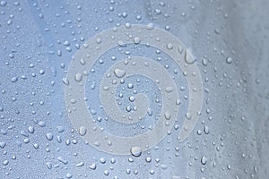 Water droplets on transparent material.