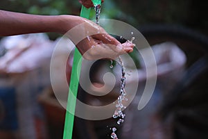 Water dropping from orange pipe