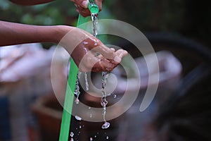 Water dropping from orange pipe