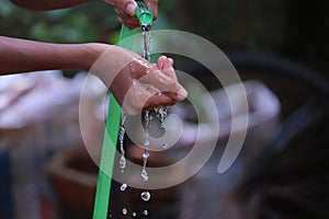 Water dropping from orange pipe