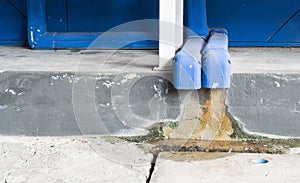 Water dropping from plastic drain pipe