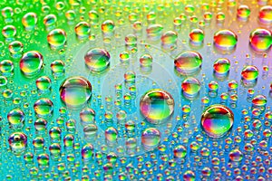 Water drops. Abstract background. Colored macro texture many drops. Iridescent wet gradient. Heavily textured image. Small depth
