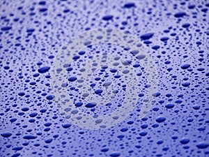 water drops on blue car background