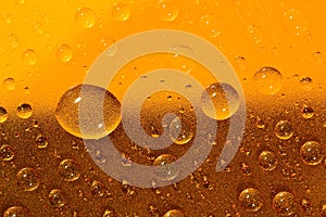 Water drops on the brown surface. Selective focus.