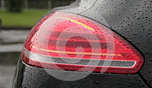 Water drops on car rear lights after anti rain protection coating stock photos