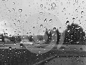 Water drops on car window in rainy day