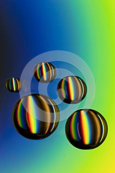 Water drops on CD with colorful rainbow