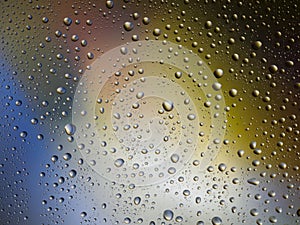 Water drops color background rain glass space rainbow.