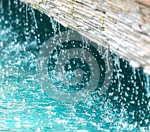 Water drops in a fountain as a background