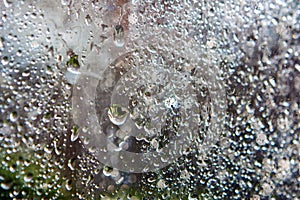 Water drops on the glass close up