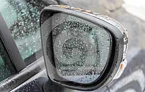 Water drops on glass of rear view morrow. rainy weather