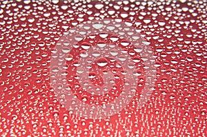 Water drops on glass red and white photo