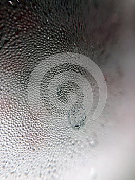 Water drops on glass. texture of frozen water drops on cool ice glass