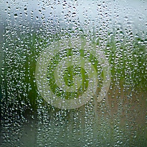 water drops on the glass wet window glass with splashes and drops of water