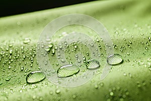 Water drops on green fabric