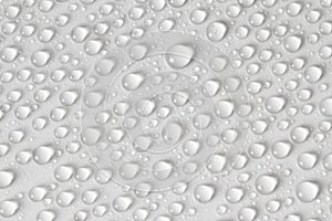 Water drops on light background. Top view. Closeup