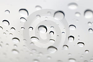 Water drops on mirror, water bubble drops wallpaper, rain drop on glass for background selective focus