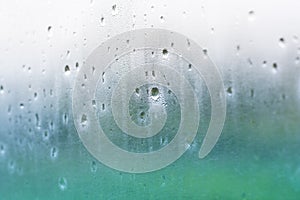 Water drops on misted glass