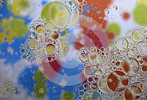 Water Drops and Oil on multicolored background