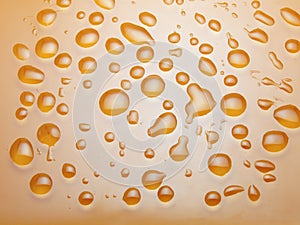 Water drops on orange background