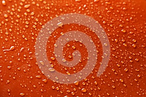 Water drops on the orange background
