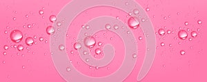 Water drops on pink background, spherical bubbles