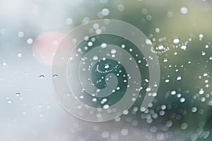 Water drops of rain on car windshield